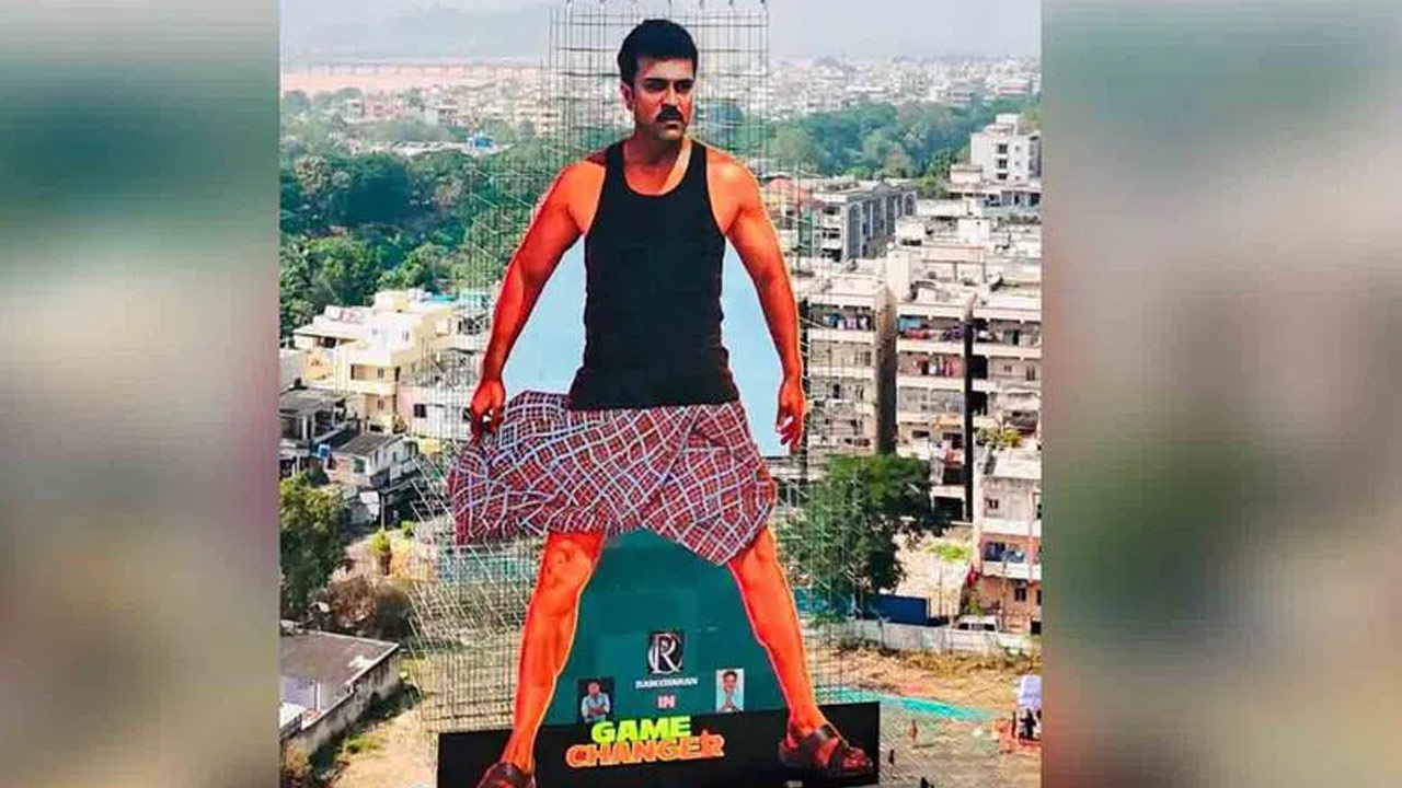 256 Foot Ram Charan Cutout Unveiled in Vijayawada Watch the Video 256 Foot Ram Charan Cutout Unveiled in Vijayawada Watch the Video